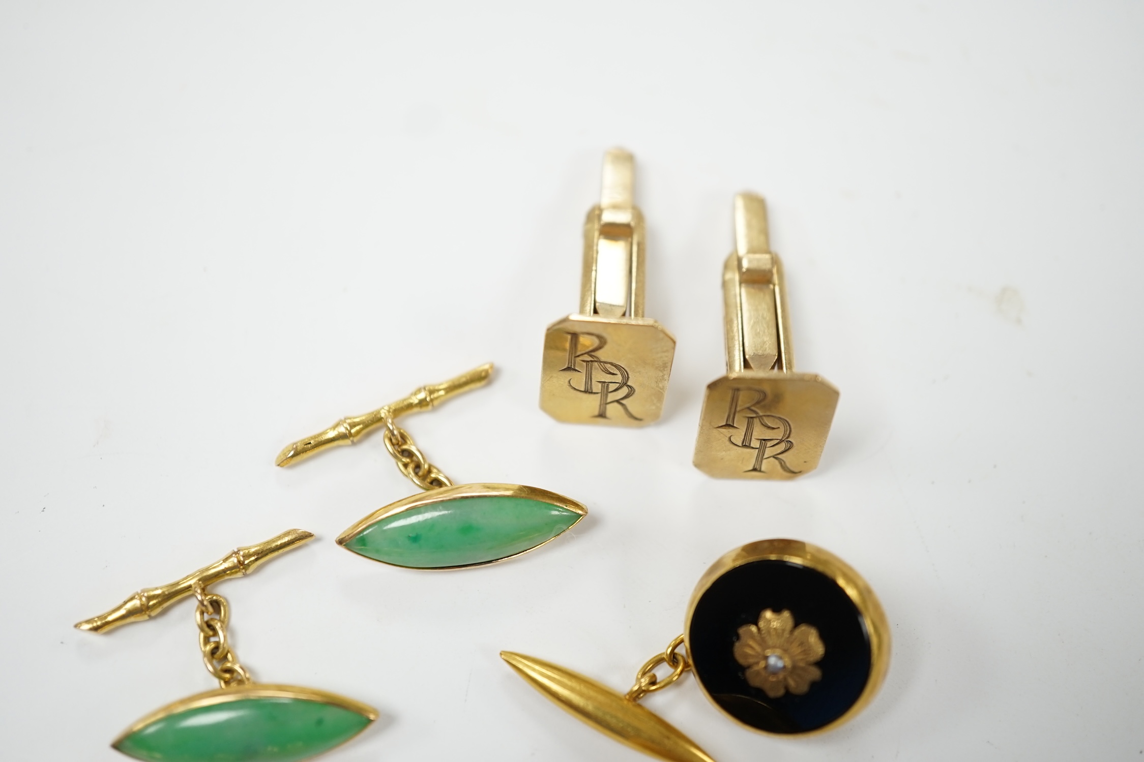 A pair of Edwardian 15ct gold torpedo shaped cufflinks, 9,6 grams and three other pairs of cufflinks including Chinese jade and monogrammed 9ct gold. Fair to good condition.